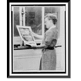 thumbnail image 1 of Historic Framed Print, [Alma Hitchcock, three-quarter length portrait, left profile, holding poster of Alfred Hitchcock's film, Rear window"]", 17-7/8" x 21-7/8", 1 of 9