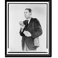 thumbnail image 1 of Historic Framed Print, [Don Hollenbeck, half-length portrait, facing left, modelling new walkie-talkie set], 17-7/8" x 21-7/8", 1 of 9