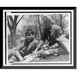 thumbnail image 1 of Historic Framed Print, [FSA staff members John Collier, reclining, and Jean Lee, eating an apple, taking a break out-of-doors], 17-7/8" x 21-7/8", 1 of 9