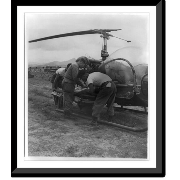 Historic Framed Print, Final check is made by Capt. Robert Crilly of the Army Medical Corps just before a helicopter of the Army's 2nd Helicopter Detachment takes off for a rear ar, 17-7/8" x 21-7/8"
