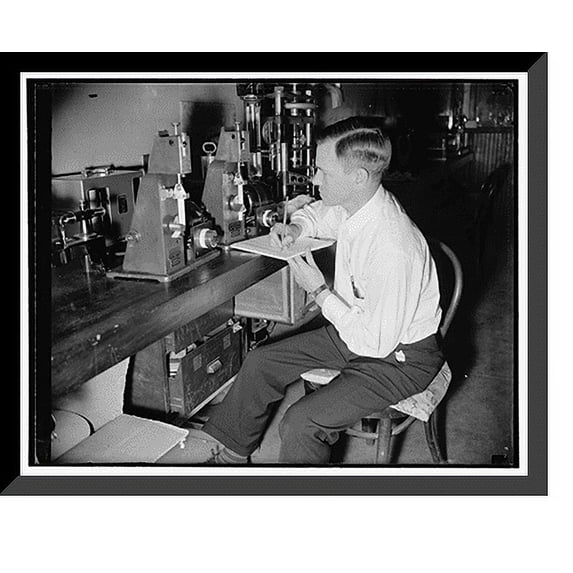 Historic Framed Print, Government discovers method to preseve film. Folding endurance test, The flexibility is measured in this folding endurance tester., 17-7/8" x 21-7/8"