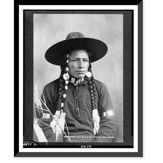 Historic Framed Print, [Half-length portrait of Indian with decorated face, feather and bead ornaments, seated, facing right].D.D. Wilder, The Dalles, Ore., photographer, novelties, 17-7/8" x 21-7/8"