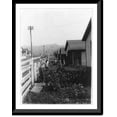 thumbnail image 1 of Historic Framed Print, [Homes of Consolidation Coal Co. employees in Hutchison, W. Va., improved with flowers and vines; children in yard], 17-7/8" x 21-7/8", 1 of 9