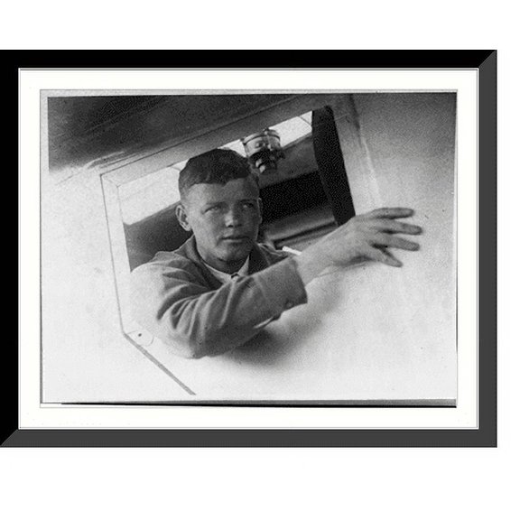 Historic Framed Print, Lindbergh looking out of window of his plane, 17-7/8" x 21-7/8"