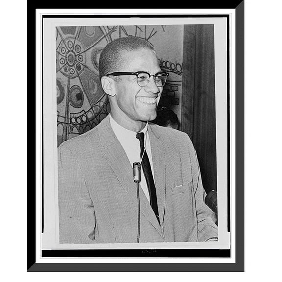Historic Framed Print, [Malcolm X, half-length portrait, facing right].World Telegram & Sun photo by Ed Ford., 17-7/8" x 21-7/8"