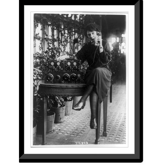 Historic Framed Print, Miss Gladys Wyville sending a kiss via wireless radio to a friend miles away - a feature of the radio show at the Hotel Pennsylvania this week, 17-7/8" x 21-7/8"