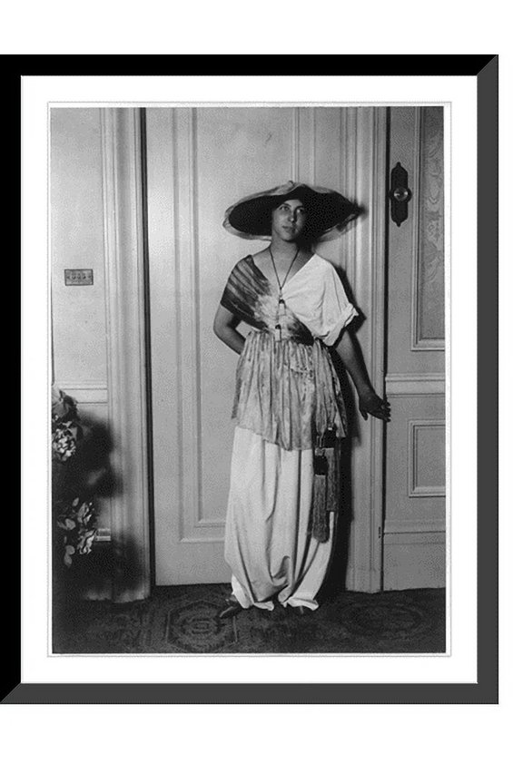 Historic Framed Print, [Mme. Paul Poiret modelling clothing designed by her husband, 1913: dress with tasseled sash], 17-7/8" x 21-7/8"