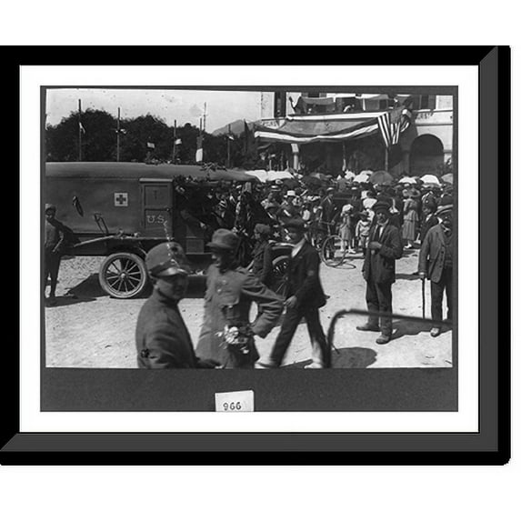 Historic Framed Print, [Parade in Luino, Italy, during World War I, showing decorated American Red Cross ambulance in foregrd. and U.S. flag on bldg. in backgrd.], 17-7/8" x 21-7/8"
