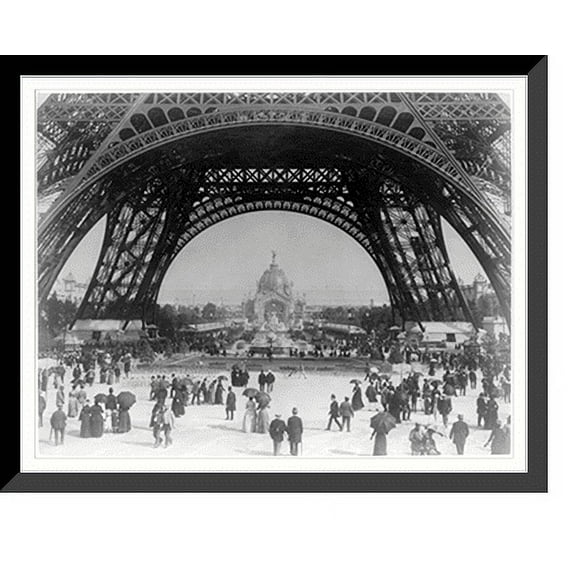 Historic Framed Print, Paris Exposition, view from ground level of the Eiffel tower with Parisians promenading, 17-7/8" x 21-7/8"