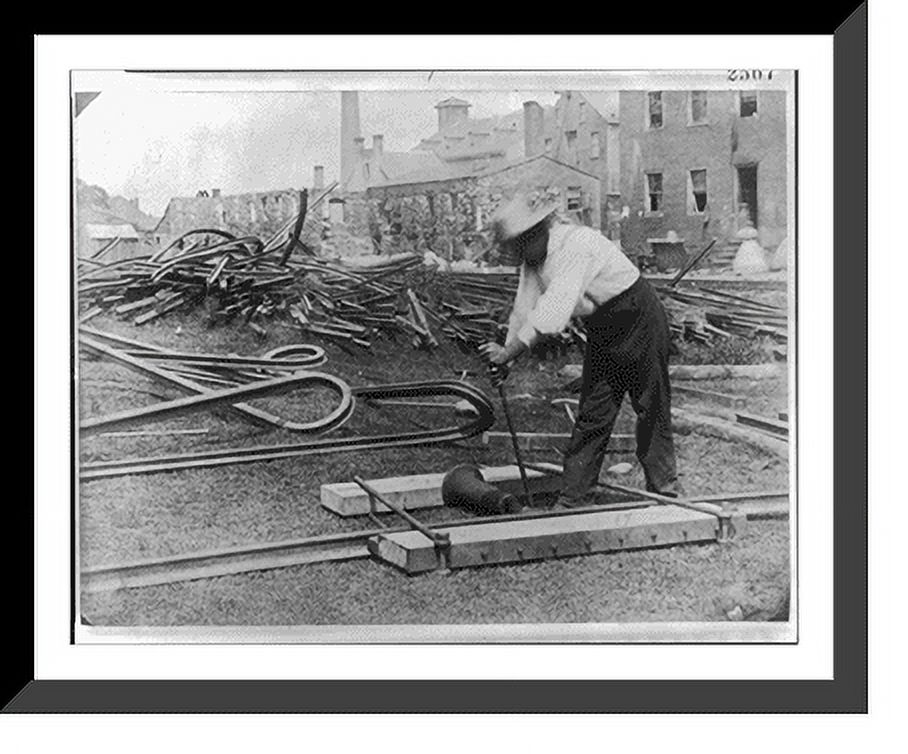 Twisted Rails Historic Framed Print, [Railroad construction worker straightening ...