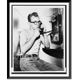 thumbnail image 1 of Historic Framed Print, Robert Kirwan, 18, of Brooklyn. (electrical shop worker) calling his sister.World Telegram & Sun photo by John Bottega., 17-7/8" x 21-7/8", 1 of 9