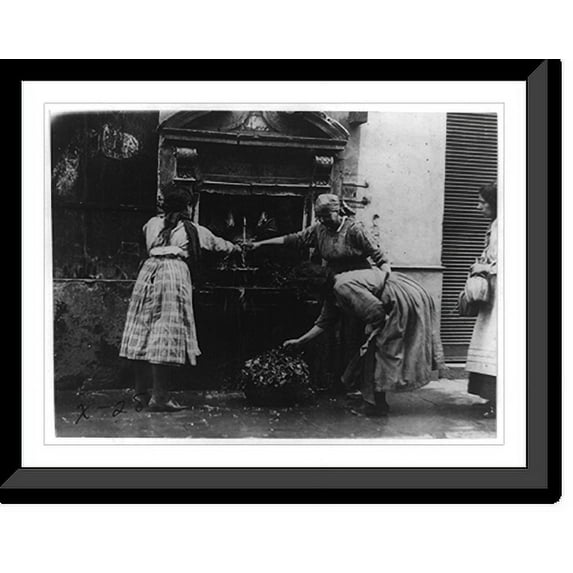Historic Framed Print, Washing fruits and vegetables at a public spigot. Italian tenements adjacent to St. Peters, Rome, Italy, 17-7/8" x 21-7/8"