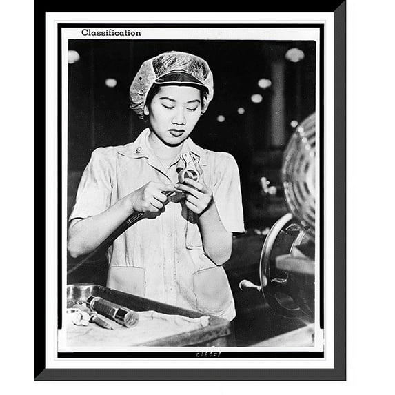 Historic Framed Print, Wong Ruth Mae Moy, a young Chinese girl who survived the Canton bombings, is working on an aircraft engine part, 17-7/8" x 21-7/8"