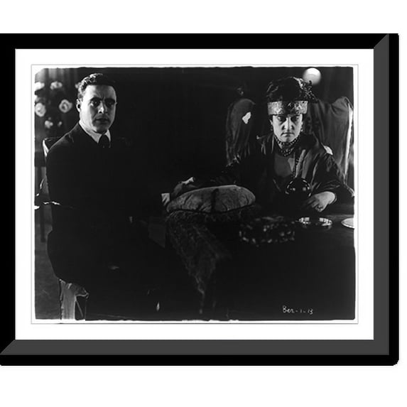 Historic Framed Print, Do you believe in spirits? George Walsh, Fox movie star, is seen gazing intently into space while a medium talks to the spirits, 17-7/8" x 21-7/8"