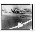 thumbnail image 1 of Historic Print, [Aerial photograph, taken by a Japanese pilot, of the destruction of Pearl Harbor, Japanese bomber in lower right foreground], 16" x 20", 1 of 3