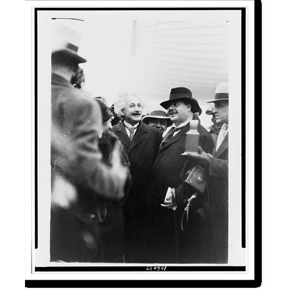 Historic Print, [Albert Einstein, three-quarter length portrait, standing with his wife in a crowd].Montauk Photo Concern, New York, N.Y., 18" x 24"