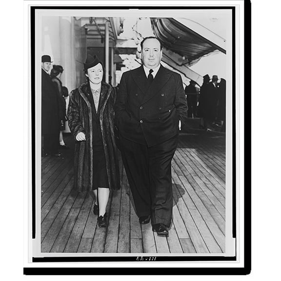 Historic Print, [Alfred Hitchcock and his wife, Alma Reville, full-length portraits, walking on deck of the SS Queen Mary].Cosmo-Sileo Co., 18" x 24"