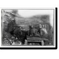 Historic Print, Brown Mine. Man digging coal by machinery low ceiling