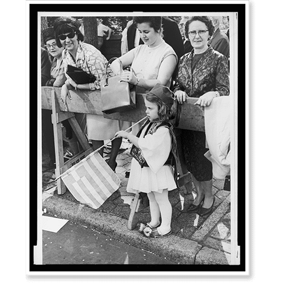 Historic Print, [Bystanders, including girl in traditional Greek dress, enjoying parade].World Telegram & Sun photo by Stanley Wolfson., 16" x 20"