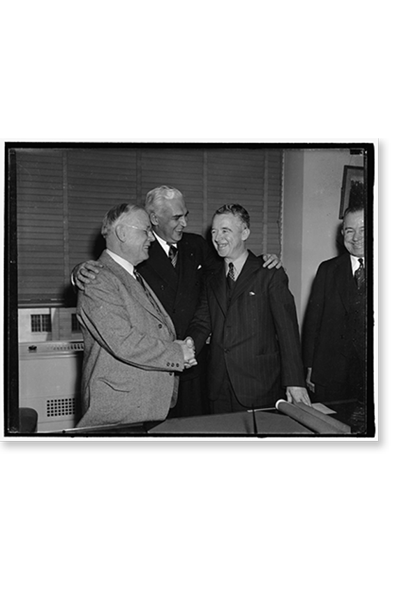 Historic Print, The C.C.C. swears in new director. Washington, D.C., March 7. While William Green, president of the AF of L, and Federal Security Administrator Paul V. McNutt, look on, …16" x 20"