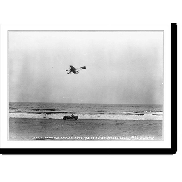 Historic Print, [Charles K. Hamilton, in biplane, racing an auto on