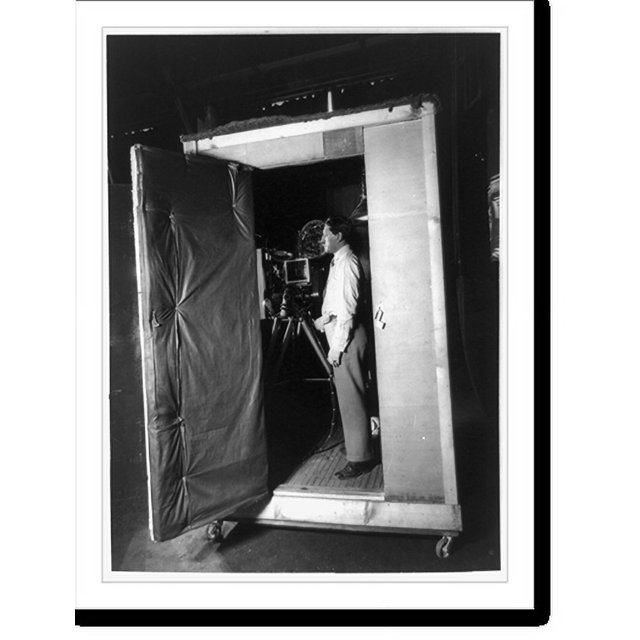 Historic Print, Chas. E. Davis, Warner Bros. cameraman, inside the new