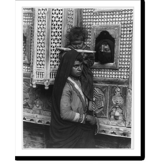 Historic Print, [Child, who is blind in one eye, seated on shoulder of woman and sucking sugar cane; and head of another woman looking through window, Egypt], 18" x 24"