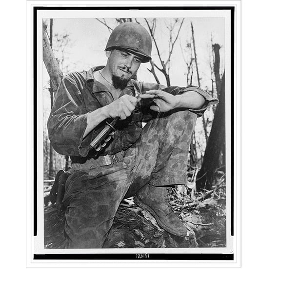 Historic Print, Clarence Terry, platoon leader from Arco, Idaho [cle]ans his nails with a trench knife after the Battle at Hastings Ridge".photo by Sgt. John Bushemi.", 16" x 20"