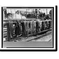 Historic Print, Clothing of oil drilling workers drying on steam pipe