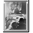 thumbnail image 1 of Historic Print, [Couple kissing at drive-in theater in Rome, Italy where Gary Cooper and Audrey Hepburn are likewise engaged on screen], 16" x 20", 1 of 3