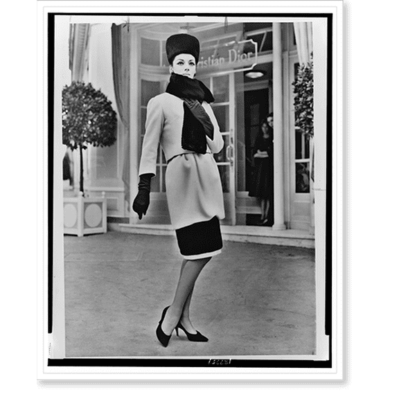 Historic Print, Dior's revolutionary short hobble skirt [...] is accented by black seal on a white cheviot costume, 16" x 20"