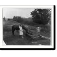 thumbnail image 1 of Historic Print, [Farm scene - barefoot girl holding reins of horse drinking from trough; water pump and aqueduct are prominent], 16" x 20", 1 of 3