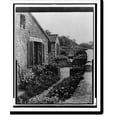 Historic Print, [Flower beds beside cottages at the A.C. James house