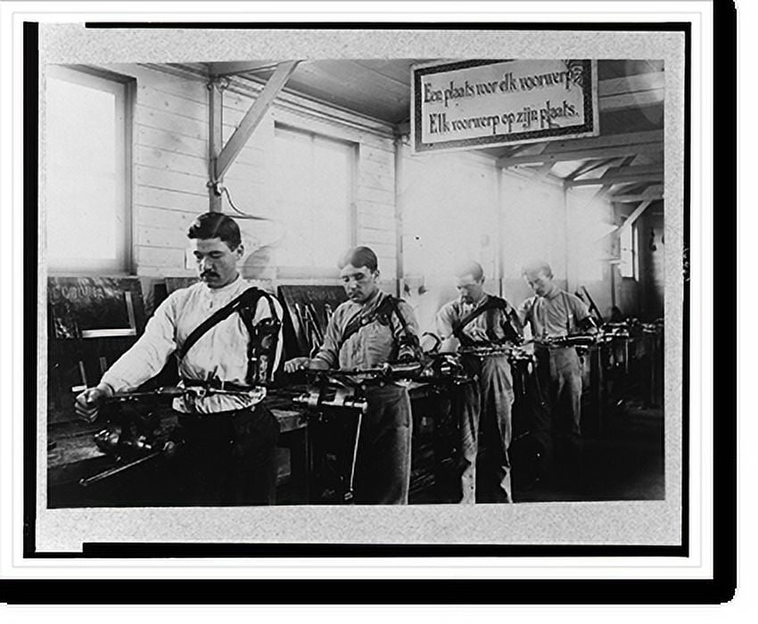 Historic Print, [Four Belgian(?) soldiers, each wearing a prothesis on his arm, working in a