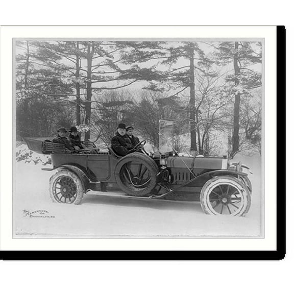Historic Print, [Four men riding in Premier" auto, with the top down, through the snow with tire chains, in a wooded area]", 18" x 24"