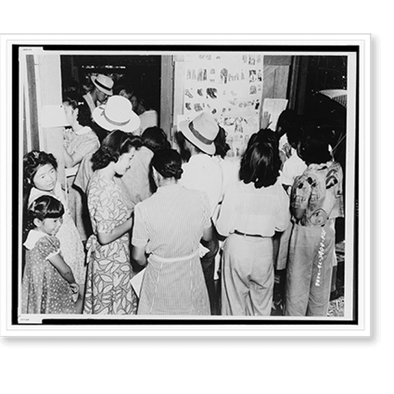 Historic Print, Fresno (Calif.) Assembly Center . Mail-order catalogues were displayed in the Centers and display sheets of apparel for sale. Here is a group of evacuees examining the ...18" x 24"