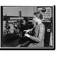 thumbnail image 1 of Historic Print, Interesting job with Uncle Sam. Washington, D.C., Oct. 13. One volt after another is all in the day's work for Mrs. L.H. Brickwedde, who is a battery expert for the Nati…16" x 20", 1 of 3