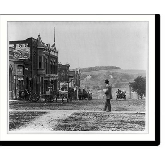 Historic Print, [Iowa. Audobon. Street scene including: horse-drawn wagon, one advertising a Chautauqua meeting; automobile; circus poster on side of building], 16" x 20"