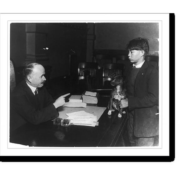 Historic Print, [Judge Benjamin Barr Lindsey seated at his desk pointing finger at boy, who is holding dog on his desk in Court House, Denver], 16" x 20"