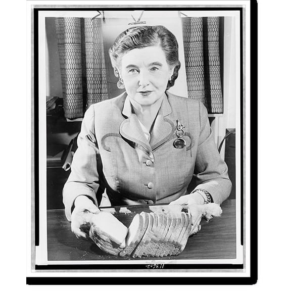 Historic Print, [Margaret Rudkin, half-length portrait, seated, facing front, holding loaf of sliced bread], 18" x 24"