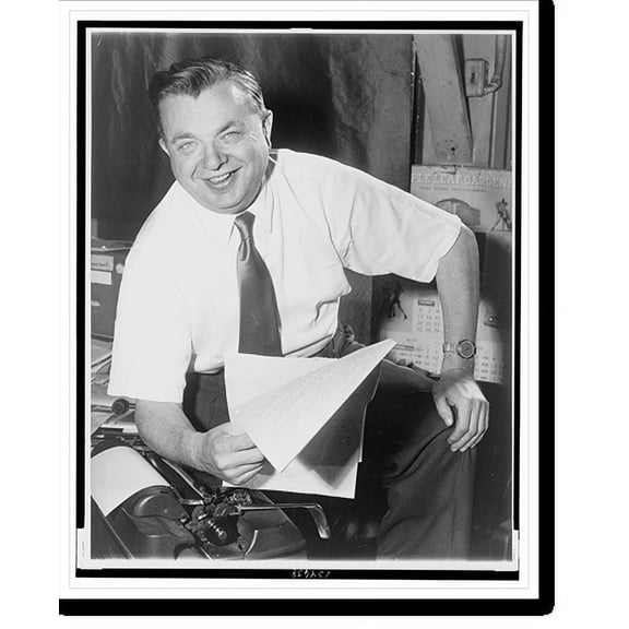 Historic Print, [Max Kase, three-quarter length candid portrait, seated at typewriter, facing front, holding papers in right hand, following announcement of a special citation from the ...18" x 24"