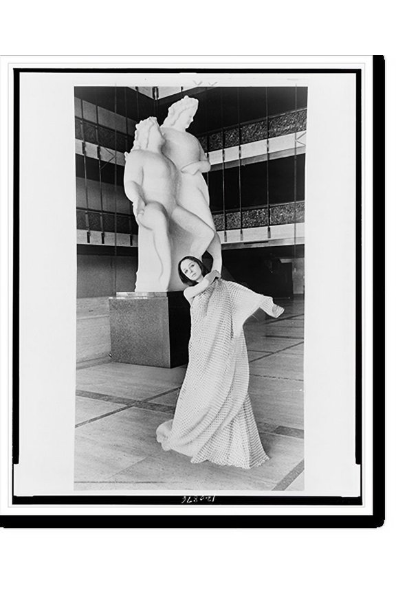 Historic Print, [Mimi Paul, full-length portrait, standing before sculpture at the New York State Theatre, facing front], 16" x 20"