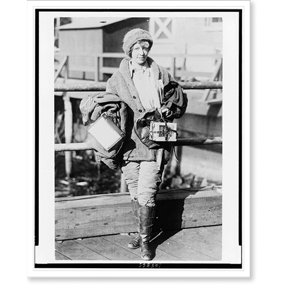 Historic Print, [Miss Ruth Law, aviator, full-length portrait, standing, facing slightly right, carrying two boxes, one the map case she designed].Herbert Photos, New York., 16" x 20"