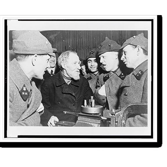 Historic Print, Moscow . Oldest worker in Sickle and Hammer Factory, participant in the first May 1st demonstration and a hero of labor, I.V. Safonov with a group of soldiers.Georgii Z…16" x 20"