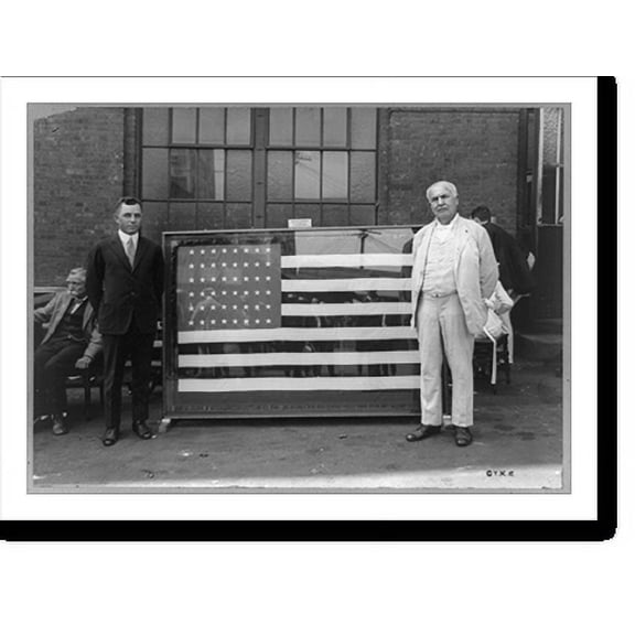 Historic Print, [Mr. Thomas A. Edison standing next to flag presented to him for the forty-third anniversary of the Ediphone invention by Ediphone Distributors], 16" x 20"