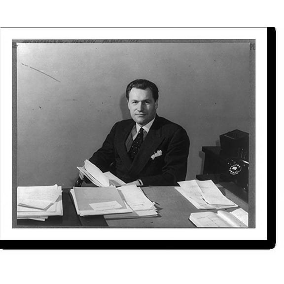 Historic Print, [Nelson Aldrich Rockefeller, 1908-, half length, seated behind desk, facing slightly left, papers in his hands; as Coordinator of Commercial and Cultural Relations betwe…16" x 20"