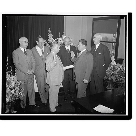 Historic Print, New S.E.C. Commissioner takes oath. Washington, D.C., May 18. Leon Henderson, whose nomination as a member of the Securities and Exchange Commission was recently approve…16" x 20"