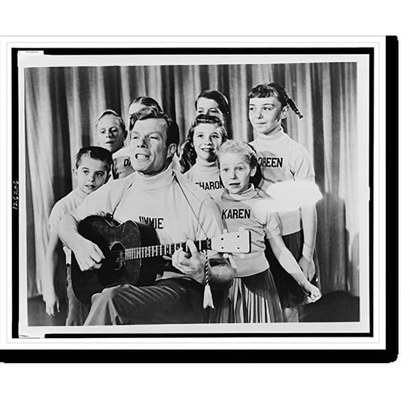 Historic Print, New television star Jimmie Dodd sings and plays the gee-tar while a group of the already-fabulous Mouseketeers" look on [...]", 16" x 20"