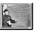 Historic Print, [Officer Richard Perry practices basic Spanish phrases