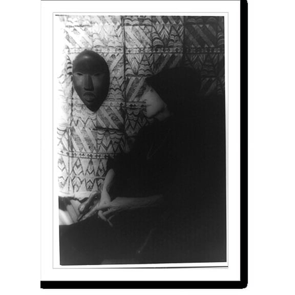 Historic Print, [Portrait of Isak Dinesen (Baroness Karen Blixen) looking at African mask and textile on wall], 16" x 20"